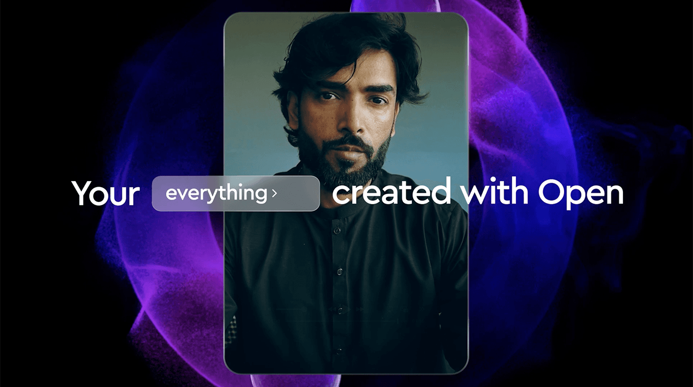 A man with dark hair and a beard is shown from the chest up, looking directly at the viewer. He is wearing a dark, possibly black, collared shirt with buttons down the front. The background is a dark, blurry mix of purple and blue hues, suggesting a dynamic or abstract setting. White text overlays the image, reading "Your" on the left, followed by a light purple, translucent button that says "everything >". To the right of the button, the text continues with "created with Open". The man's face is well-lit, highlighting his features.